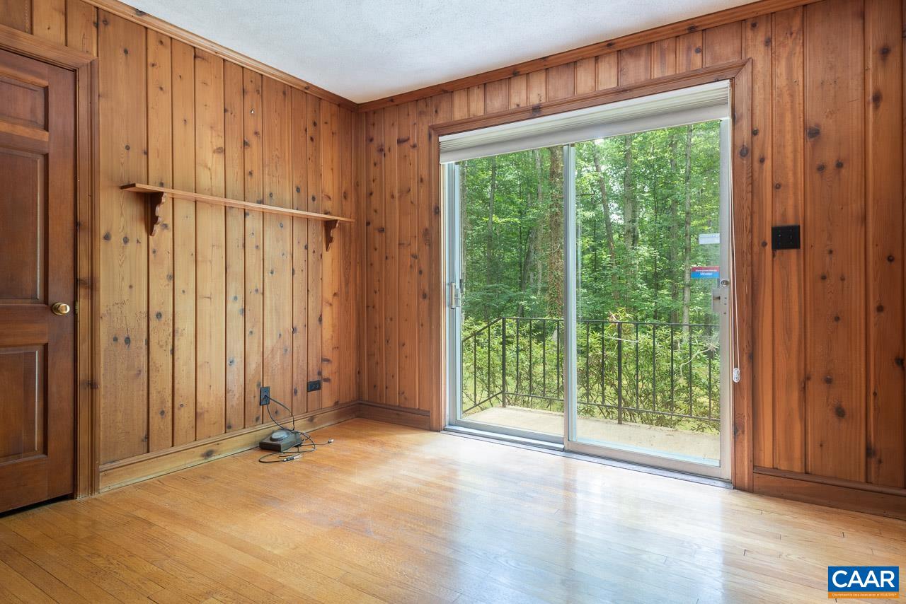 995 Shadwell Road Keswick, VA 22947 - Photo 15 of 23 an empty room with wooden floor and windows