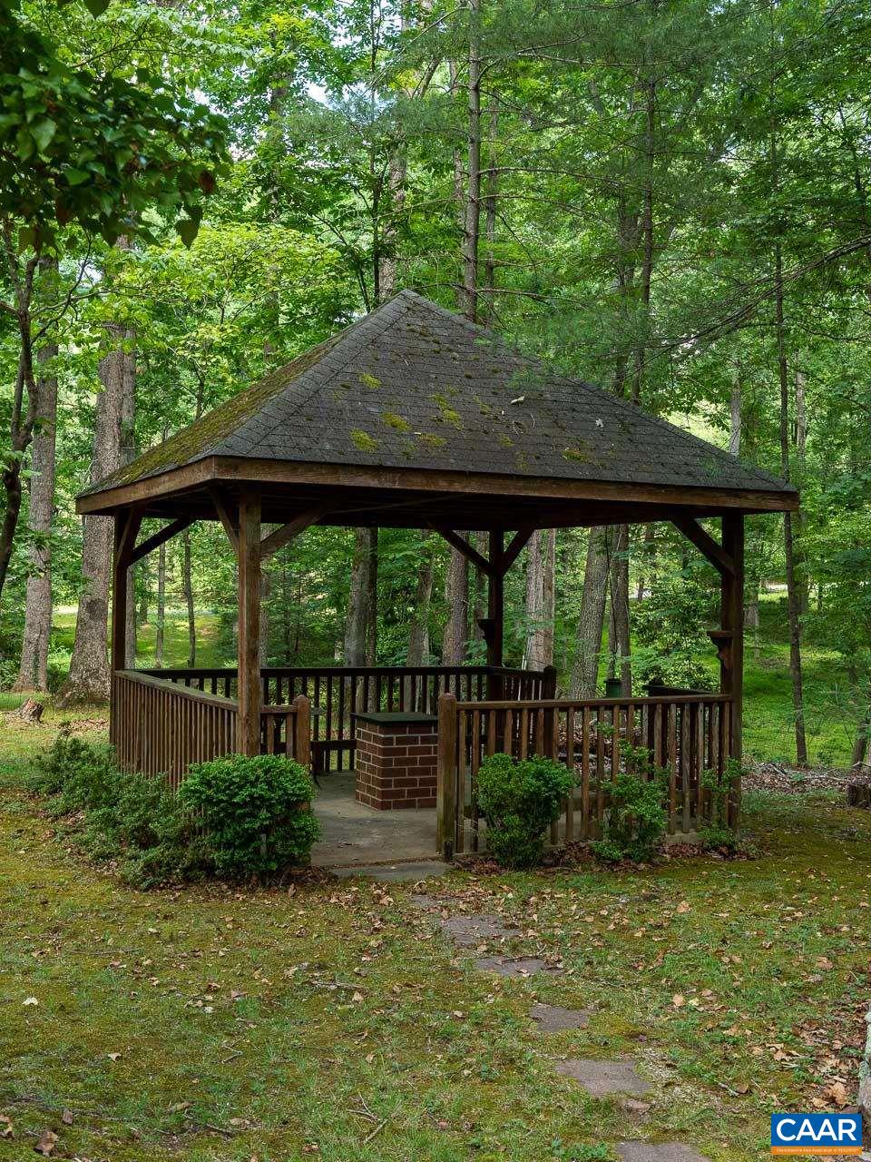 995 Shadwell Road Keswick, VA 22947 - Photo 20 of 23 a view of a house with backyard and sitting area