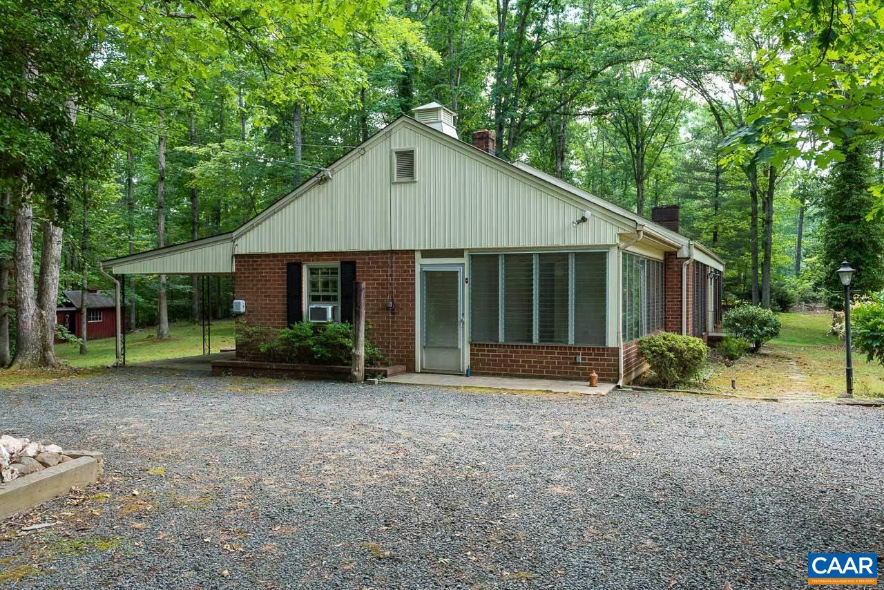 995 Shadwell Road Keswick, VA 22947 - Photo 3 of 23 a front view of a house with a yard and porch