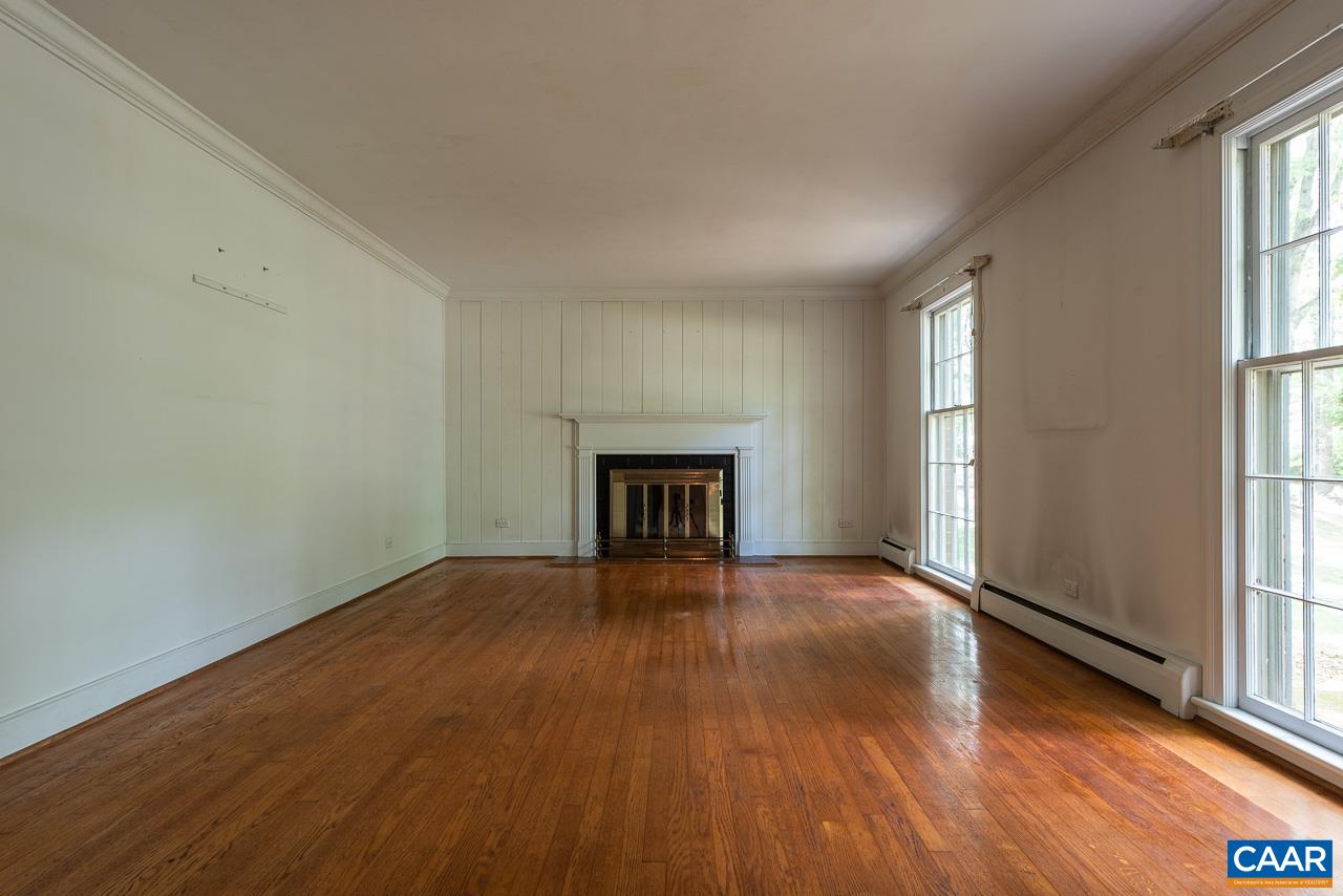 995 Shadwell Road Keswick, VA 22947 - Photo 8 of 23 an empty room with wooden floor and windows