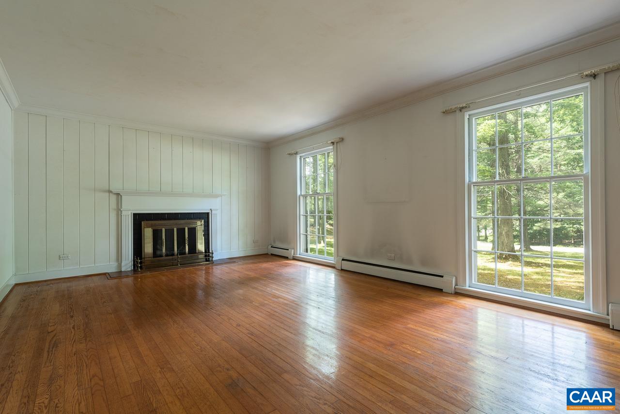 995 Shadwell Road Keswick, VA 22947 - Photo 9 of 23 a view of an empty room with wooden floor and a window