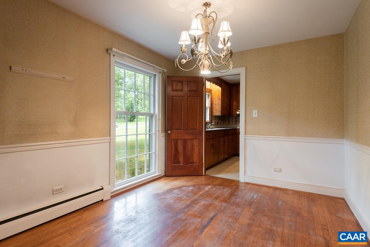 995 Shadwell Road Keswick, VA 22947 - Photo 10 of 23 a view of a room with wooden floor chandelier and windows