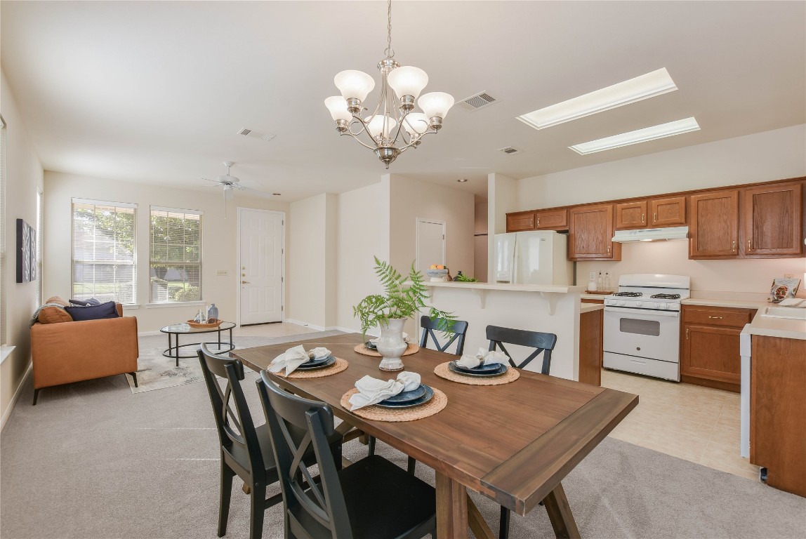 112 Anemone Way Georgetown, TX 78633 - Photo 12 of 40 a view of a dining room with furniture and chandelier