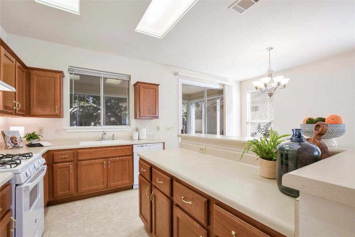112 Anemone Way Georgetown, TX 78633 - Photo 14 of 40 a kitchen with a sink and cabinets