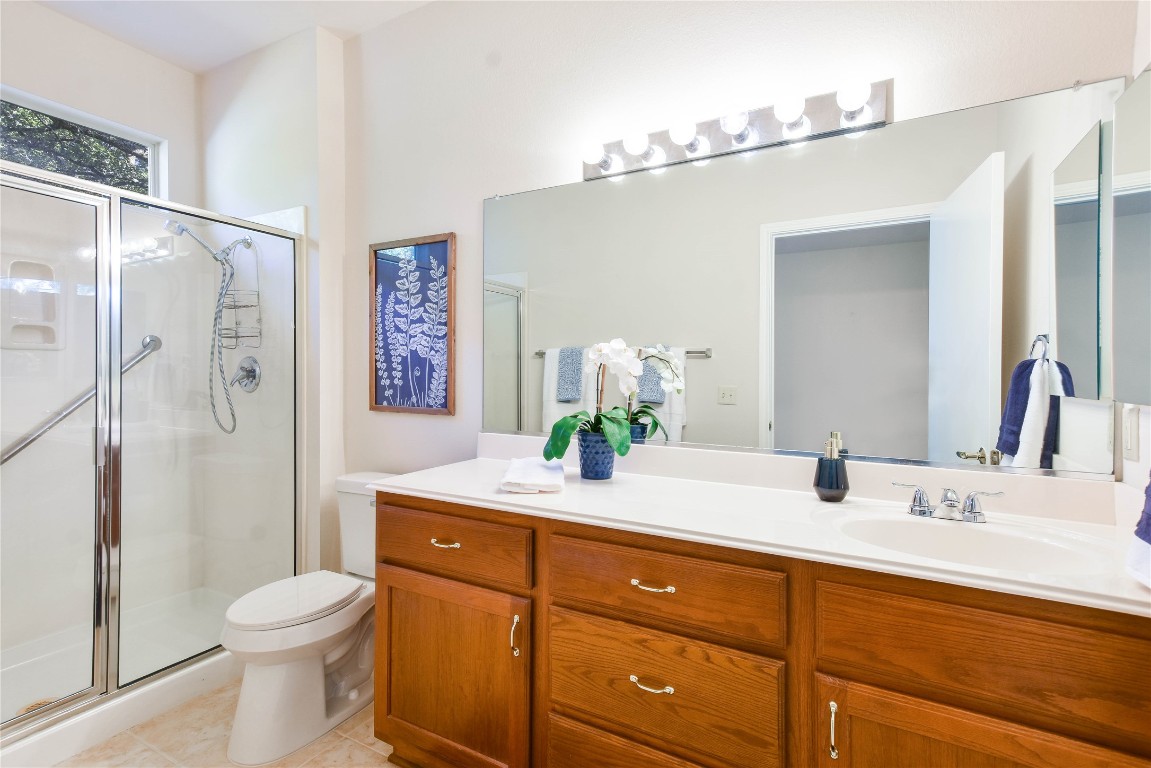 112 Anemone Way Georgetown, TX 78633 - Photo 23 of 40 a bathroom with a sink a toilet and shower
