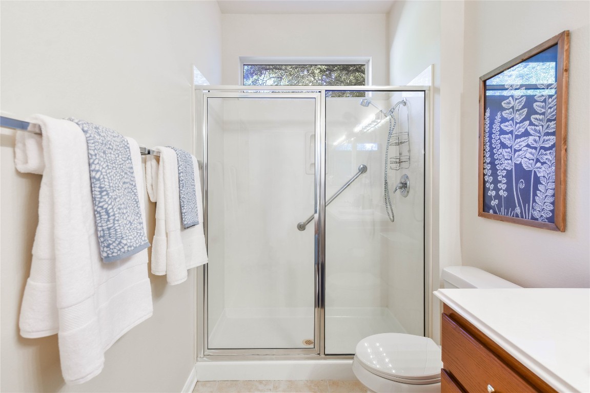 112 Anemone Way Georgetown, TX 78633 - Photo 24 of 40 a bathroom with a shower and toilet
