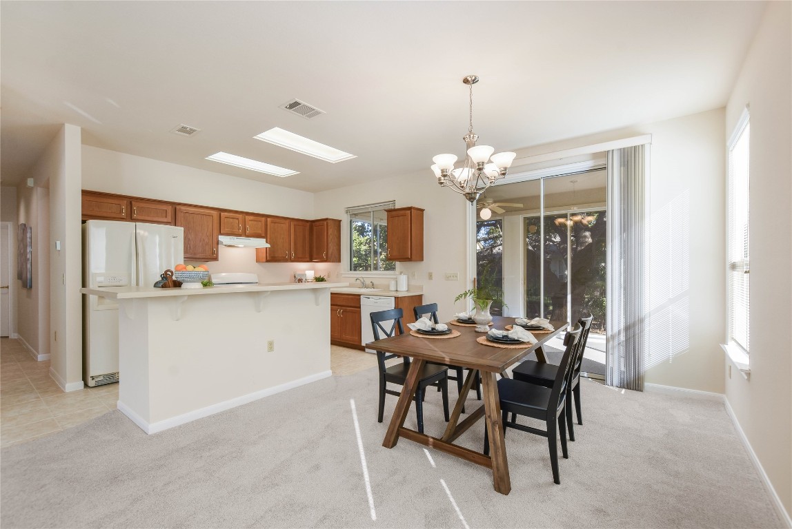 112 Anemone Way Georgetown, TX 78633 - Photo 3 of 40 a kitchen that has a table and chairs in it