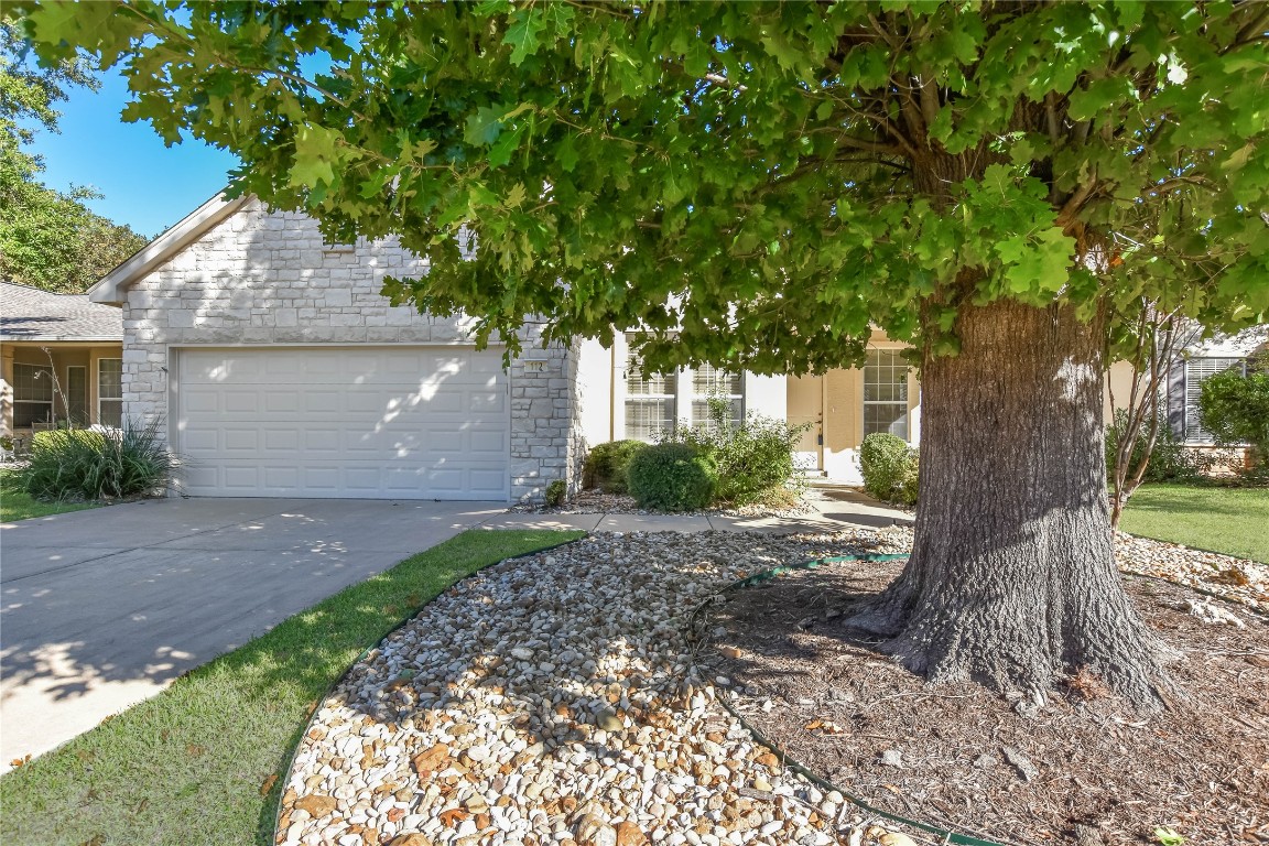 112 Anemone Way Georgetown, TX 78633 - Photo 7 of 40 a front view of a house with a garden