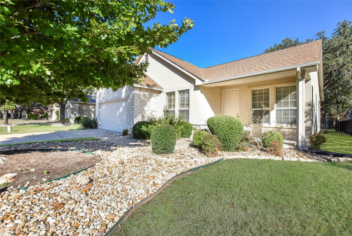 112 Anemone Way Georgetown, TX 78633 - Photo 8 of 40 a front view of a house with garden