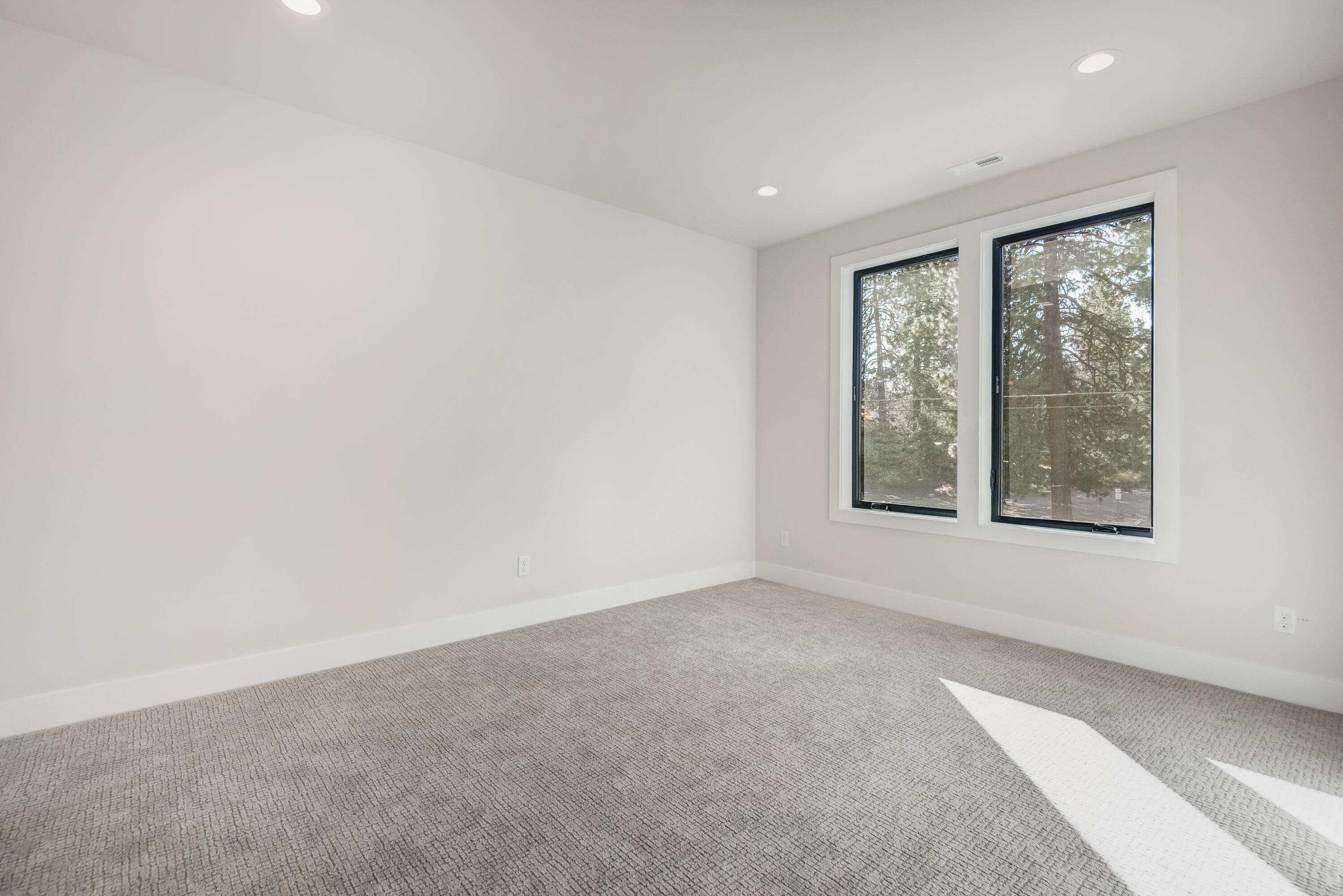 334 Southwest Roosevelt Avenue, Unit 4 Bend, OR 97702 - Photo 16 of 22 an empty room with windows