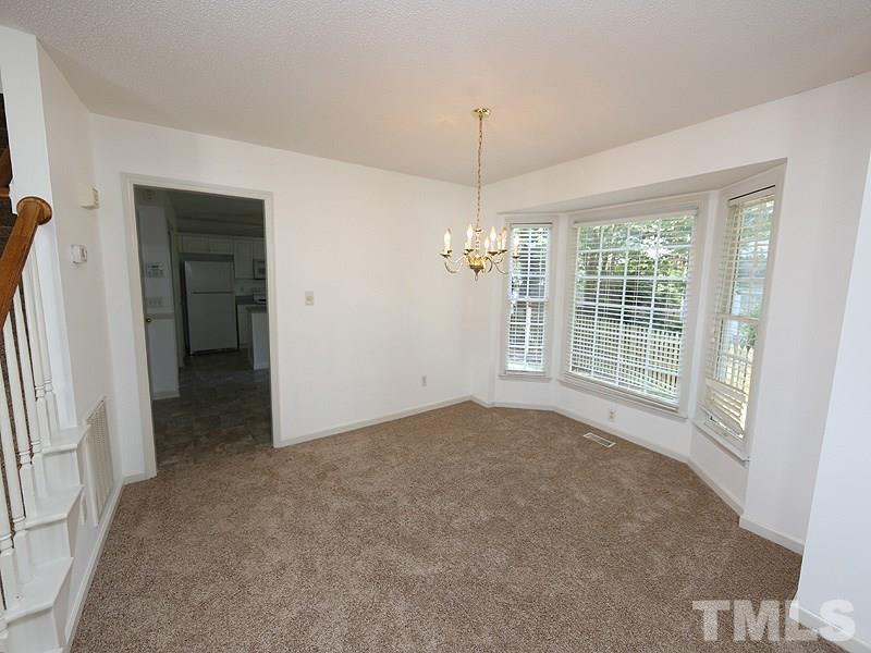 5225 Sutter Way Raleigh, NC 27613 - Photo 3 of 12 a view of an empty room with a window
