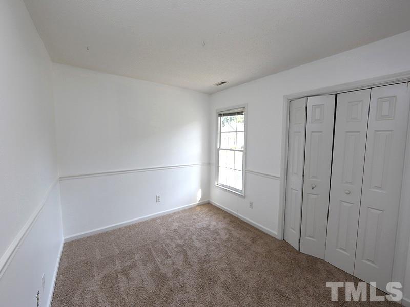 5225 Sutter Way Raleigh, NC 27613 - Photo 9 of 12 a view of an empty room with a window