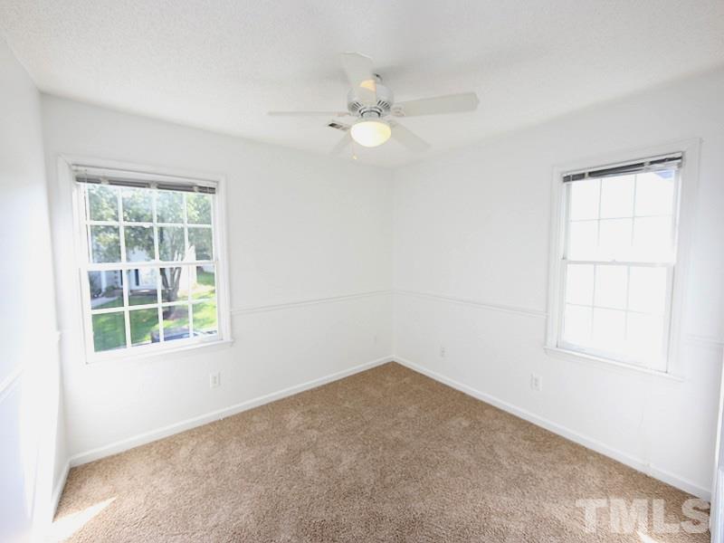 5225 Sutter Way Raleigh, NC 27613 - Photo 10 of 12 an empty room with a window