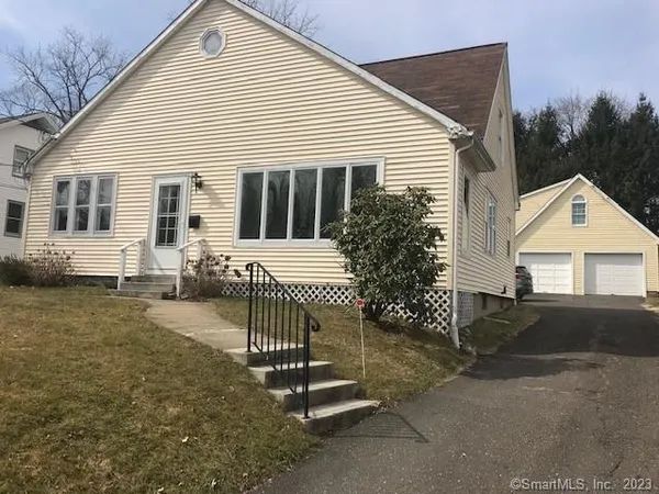 a front view of a house with a yard