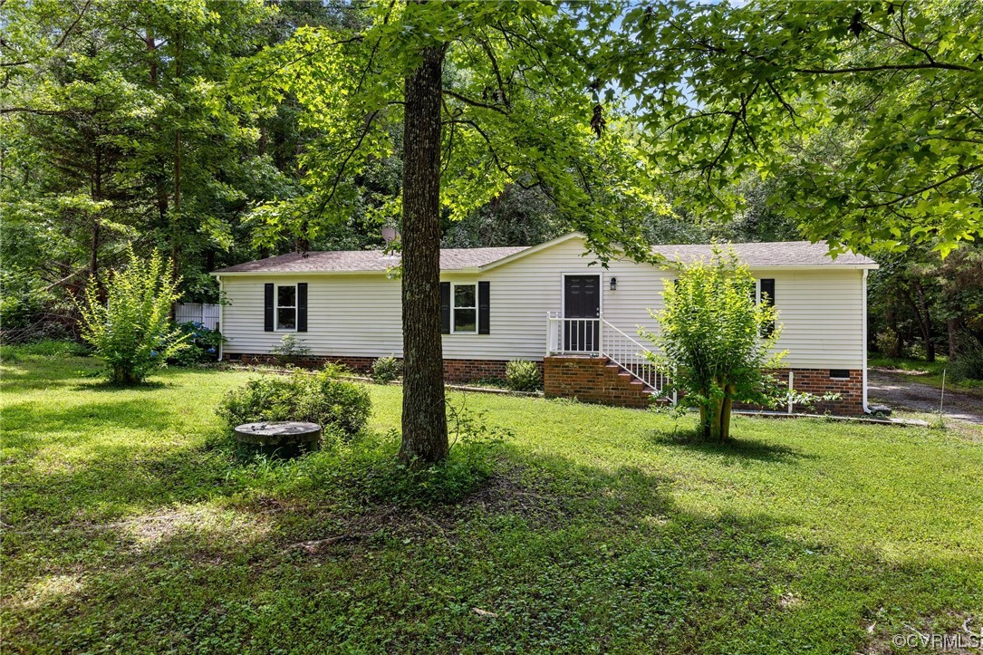 3549 Cedar Plains Road Sandy Hook, VA 23153 - Photo 1 of 26 a view of a house with backyard and garden