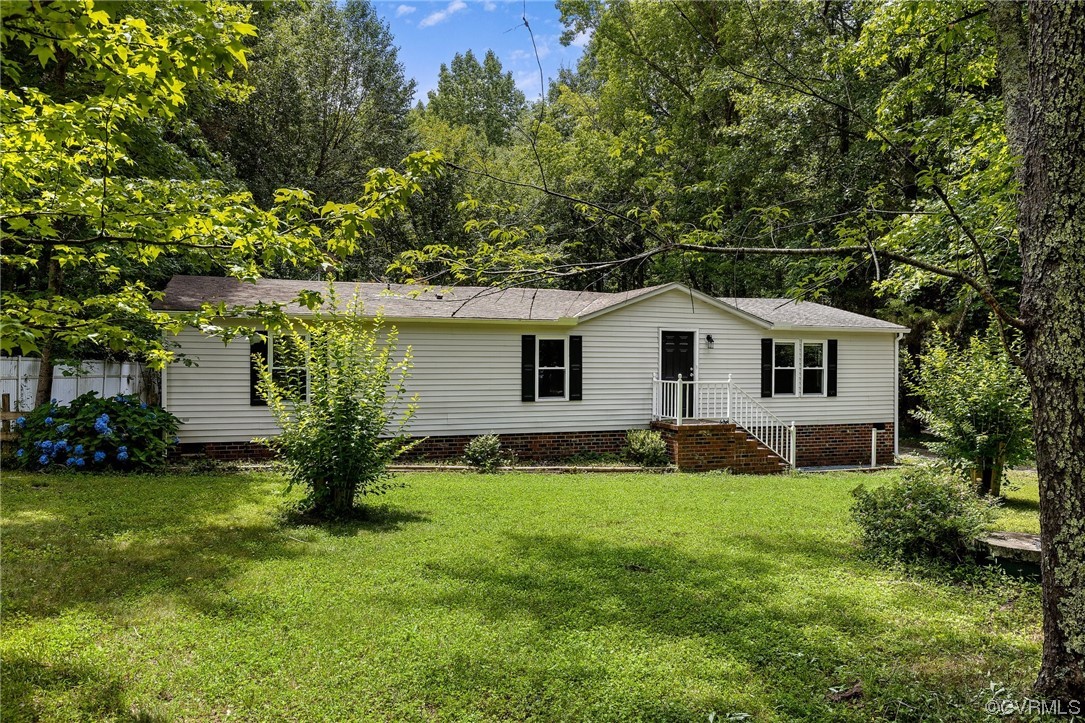 3549 Cedar Plains Road Sandy Hook, VA 23153 - Photo 2 of 26 a front view of house with yard and green space