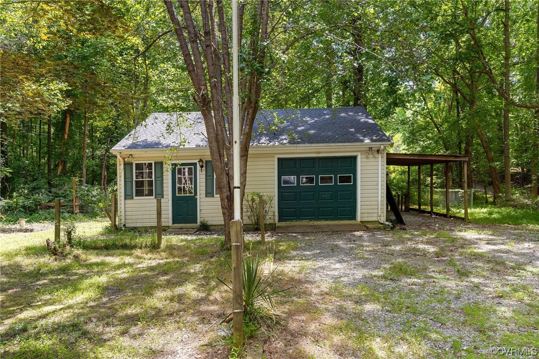 3549 Cedar Plains Road Sandy Hook, VA 23153 - Photo 25 of 26 a front view of a house with a yard