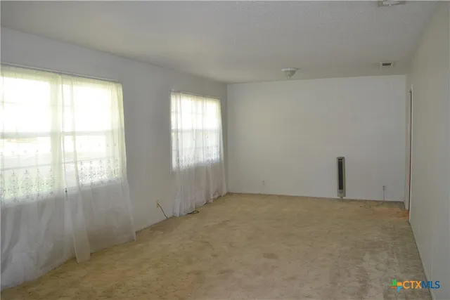 an empty room with windows