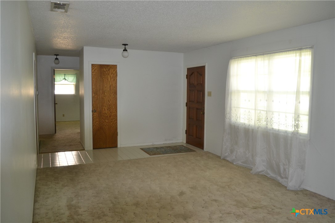 2202 South 53rd Street Temple, TX 76504 - Photo 4 of 27 an empty room with windows and closet