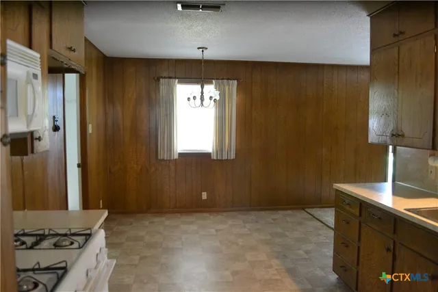 a view of a livingroom with a kitchen