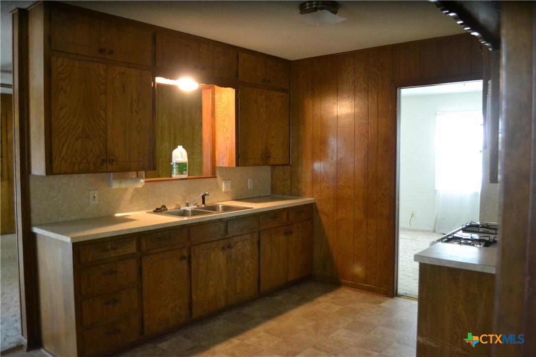 2202 South 53rd Street Temple, TX 76504 - Photo 9 of 27 a bathroom with a double vanity sink and a mirror