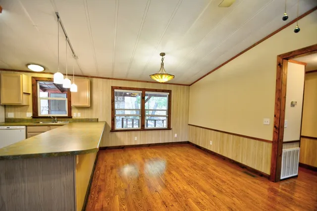 a bathroom with a tub and shower