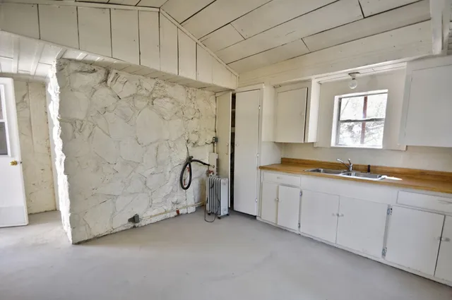 a view of empty room with windows