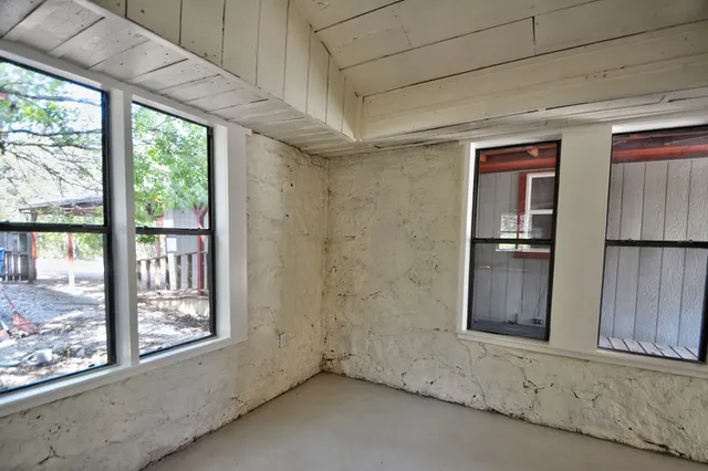 a view of an empty room and window