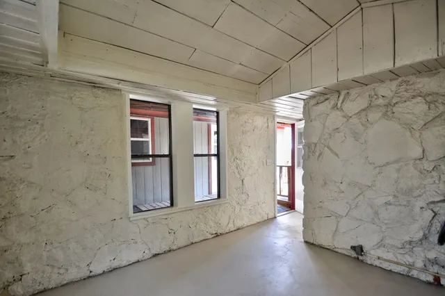 a bathroom with a shower and a window