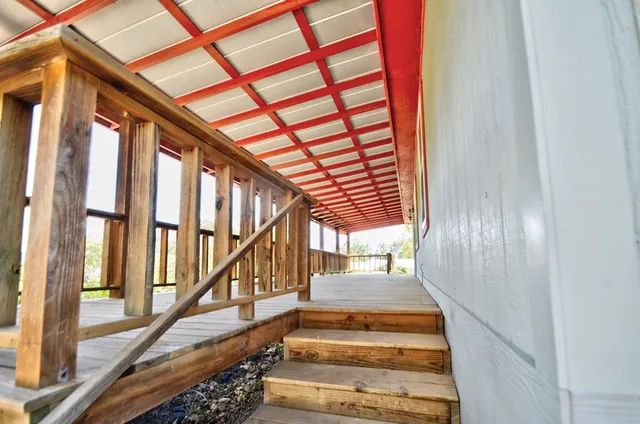 a view of balcony and yard