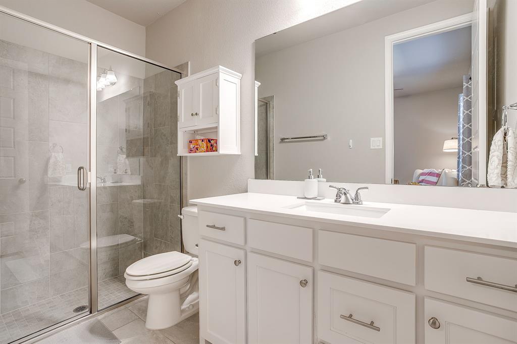 5709 Pope Creek Road Fort Worth, TX 76126 - Photo 23 of 39 Private ensuite bathroom for the main-floor guest bedroom.