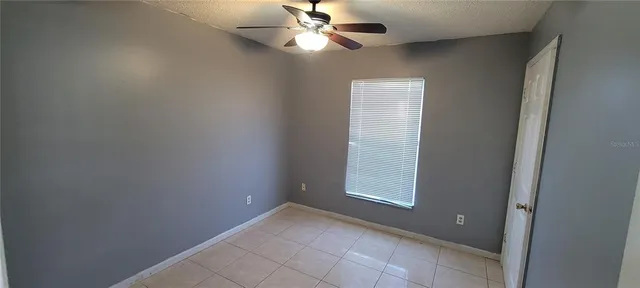 a bathroom with a bathtub and window