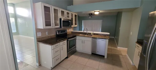 a kitchen with a stove and a microwave