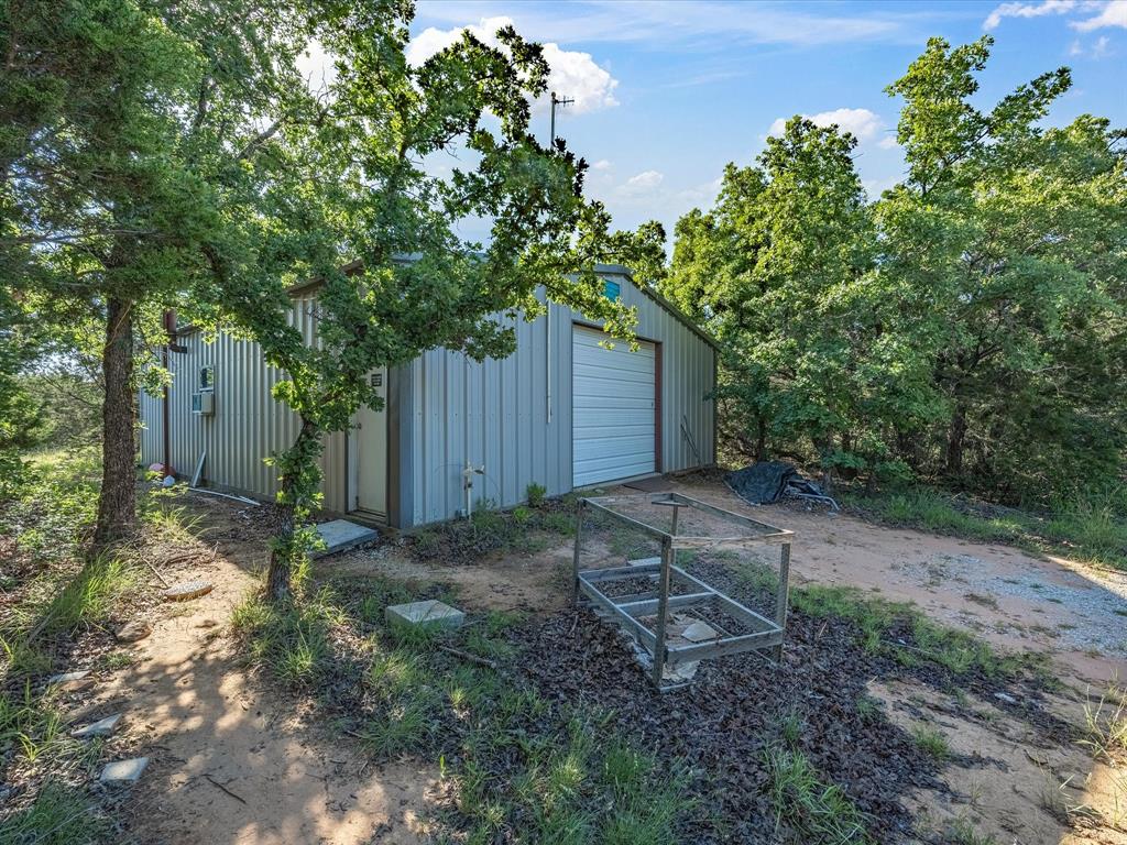 3275 Finis Road Graham, TX 76450 - Photo 32 of 36 a backyard of a house with lots of green space