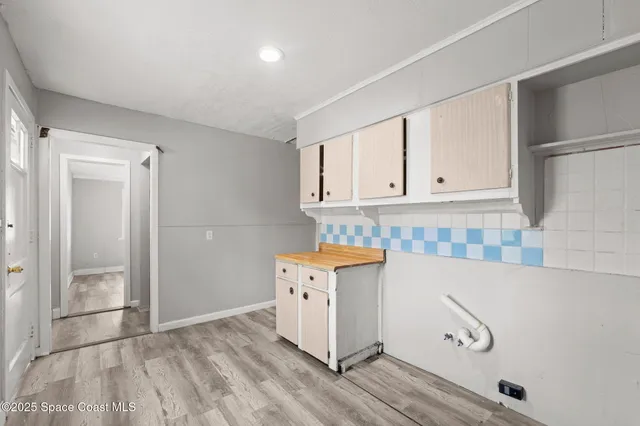 a view of cabinets with wooden floor