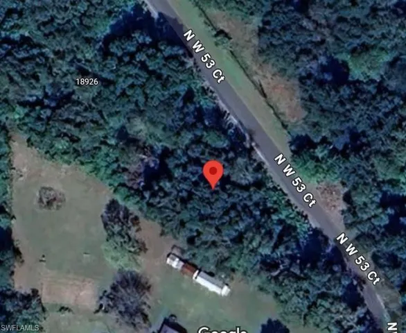 a view of a street with a trees