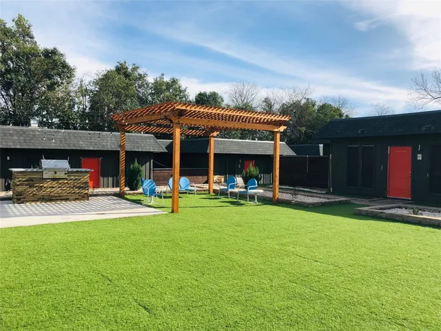 a view of a house with swimming pool and sitting area