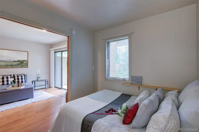 a bedroom with a bed and window