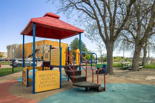 an outdoor space with furniture and umbrella