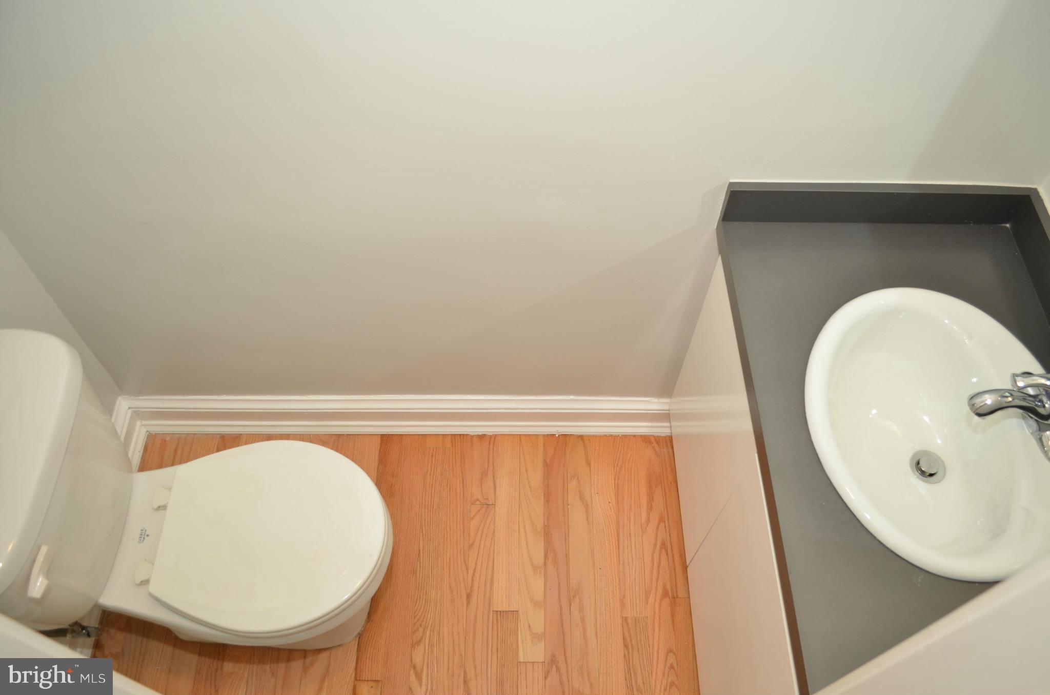 3134 38th Street Northwest Washington, DC 20016 - Photo 15 of 30 a bathroom with a sink and mirror