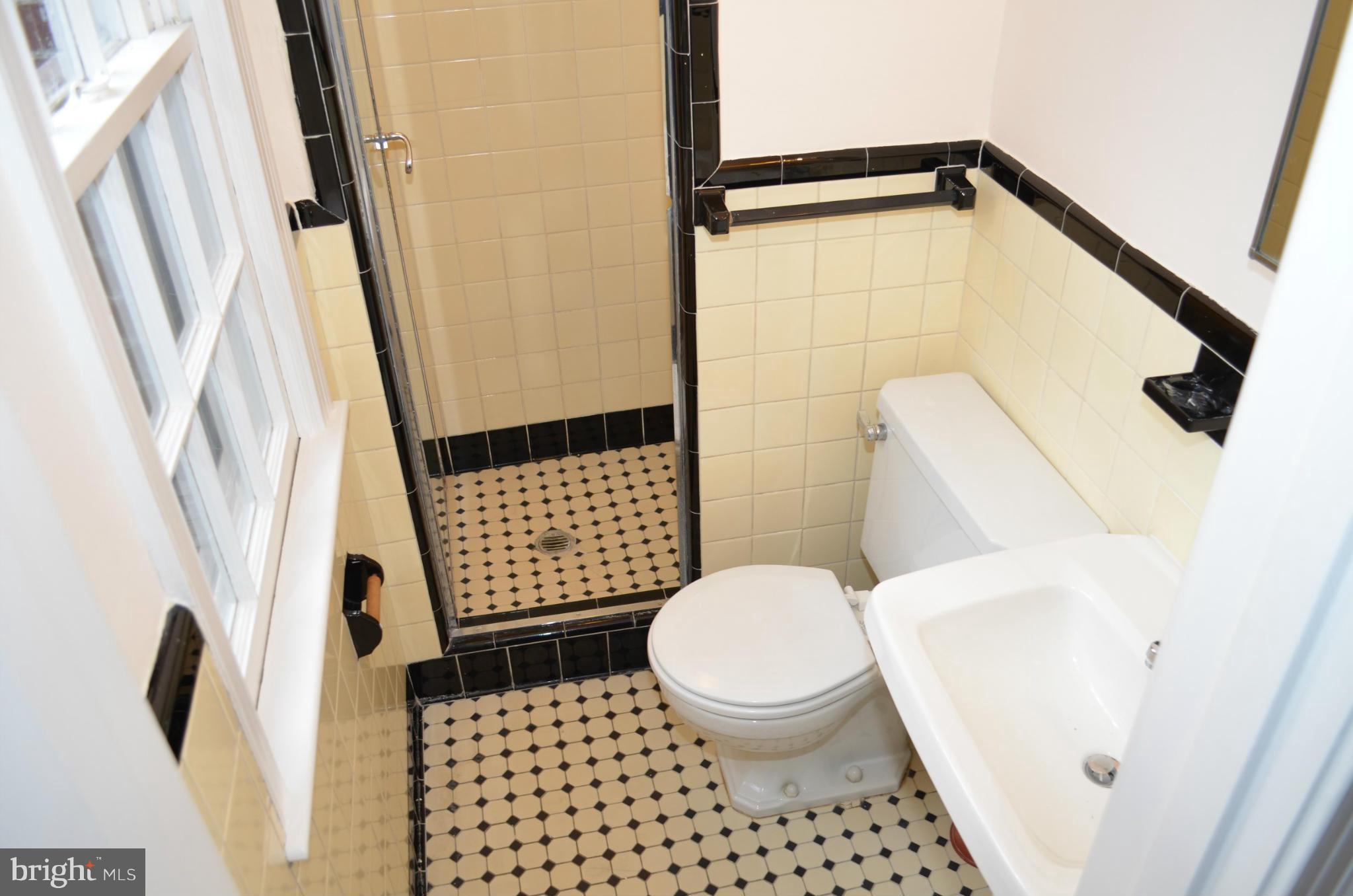3134 38th Street Northwest Washington, DC 20016 - Photo 19 of 30 a bathroom with a toilet and a shower