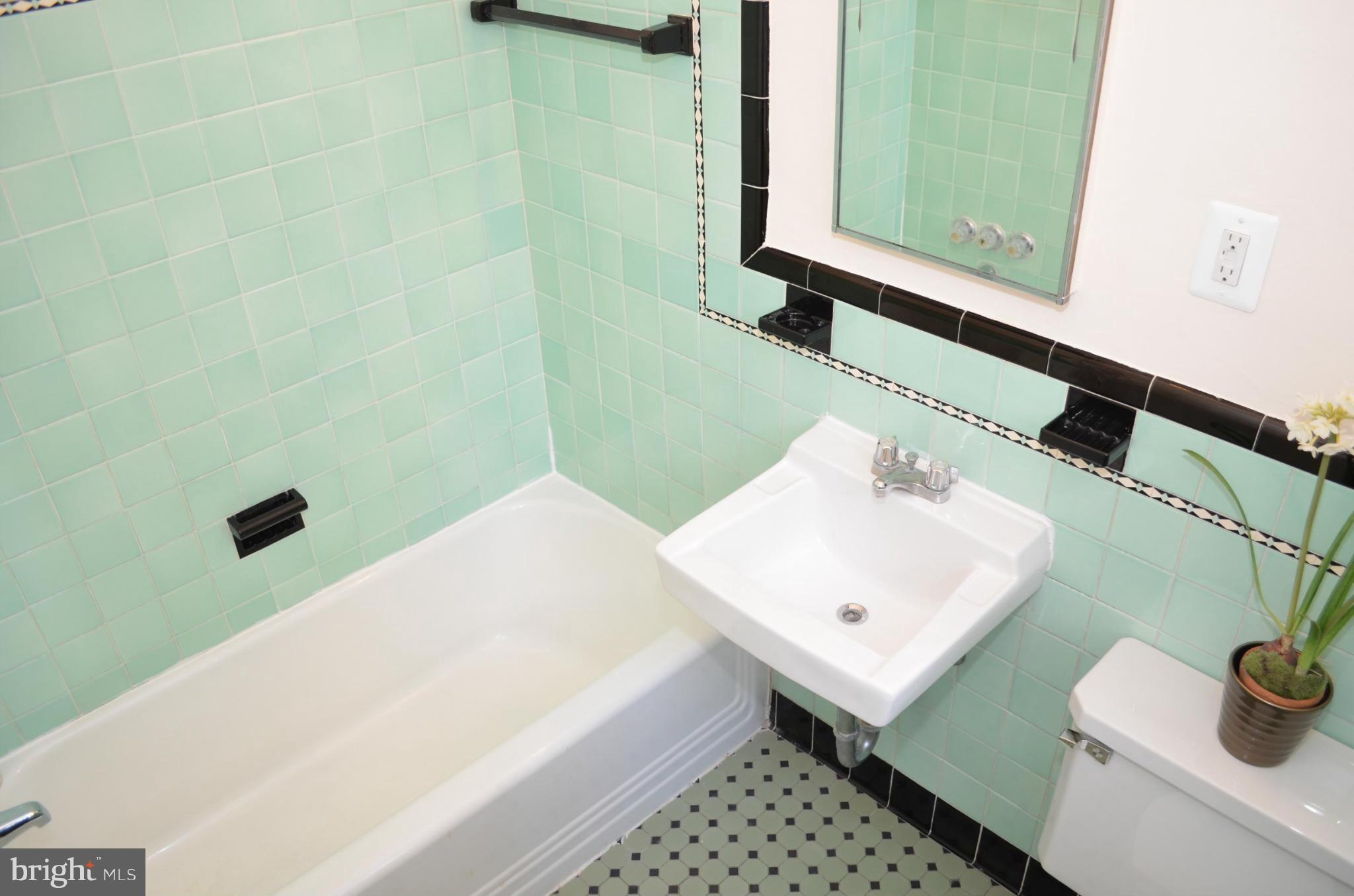 3134 38th Street Northwest Washington, DC 20016 - Photo 22 of 30 a bathroom with a sink and a mirror