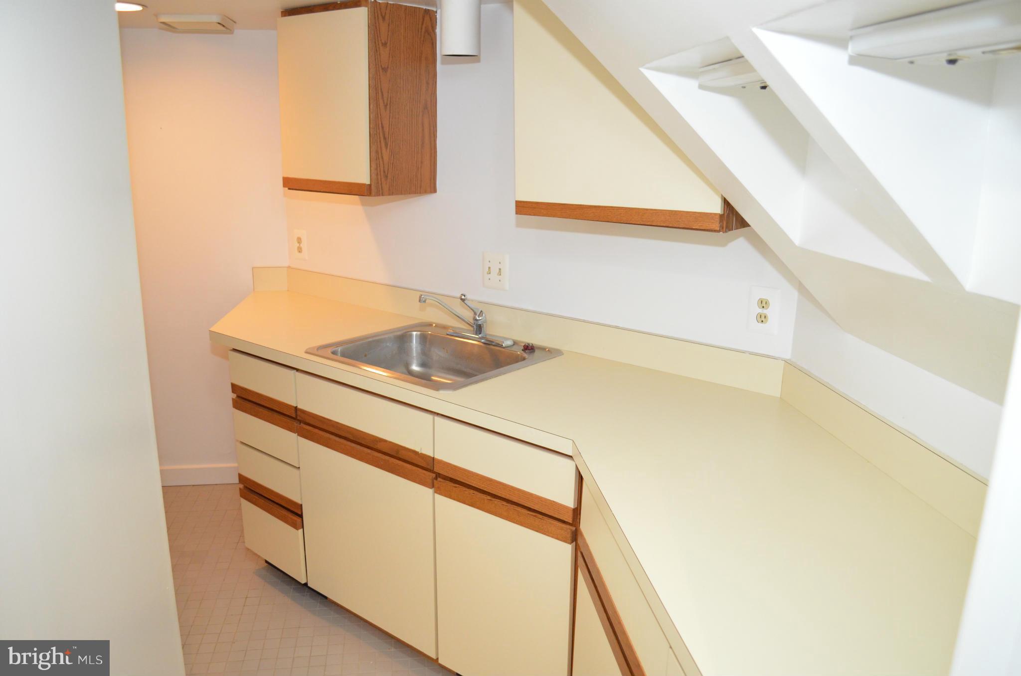 3134 38th Street Northwest Washington, DC 20016 - Photo 25 of 30 a bathroom with a sink and a mirror