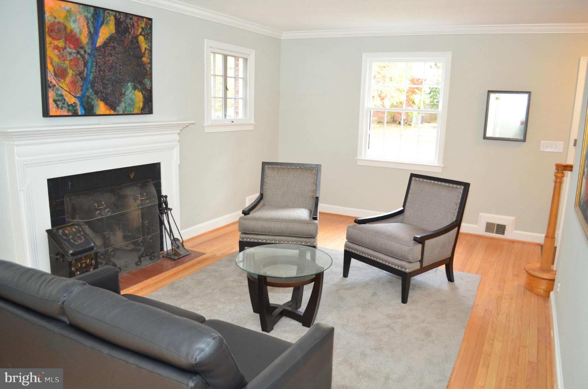 3134 38th Street Northwest Washington, DC 20016 - Photo 5 of 30 a living room with furniture and a fireplace
