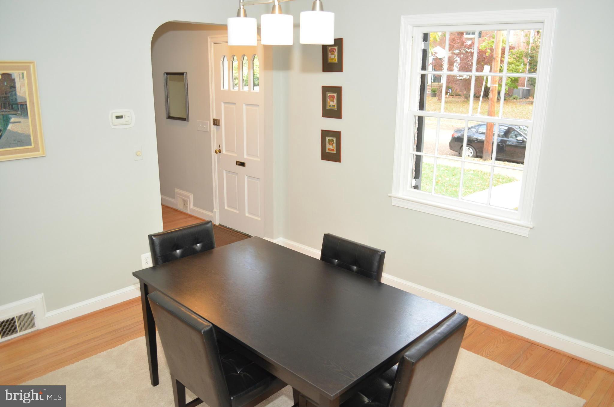 3134 38th Street Northwest Washington, DC 20016 - Photo 10 of 30 a view of livingroom and dining room with furniture