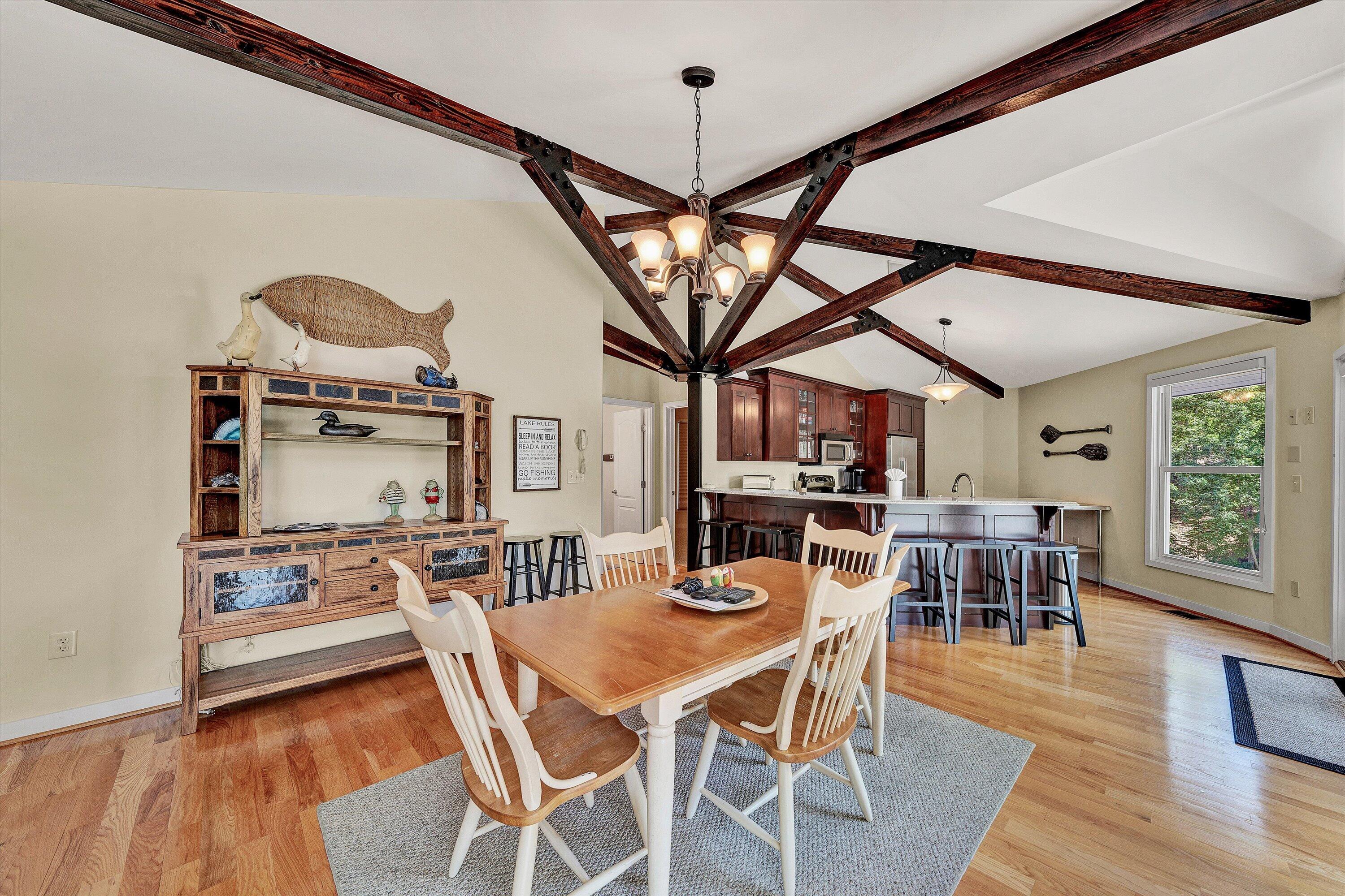 207 Winding Way Union Hall, VA 24176 - Photo 11 of 60 a view of a dining room with furniture window and wooden floor