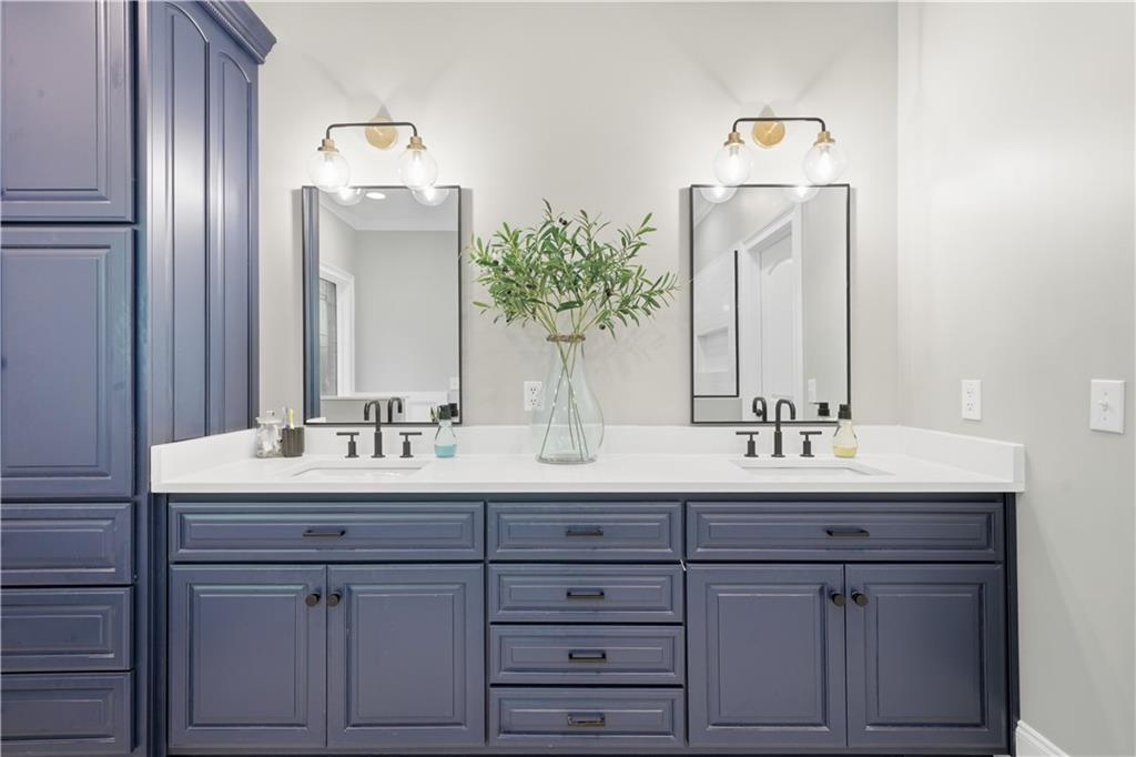 310 Gaines Road Southeast Dalton, GA 30721 - Photo 24 of 53 a bathroom with a double vanity sink and a mirror