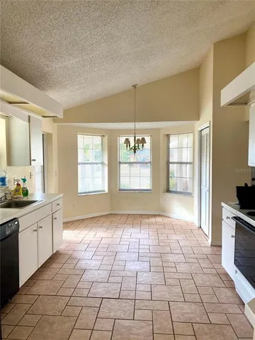 a view of a kitchen with windows