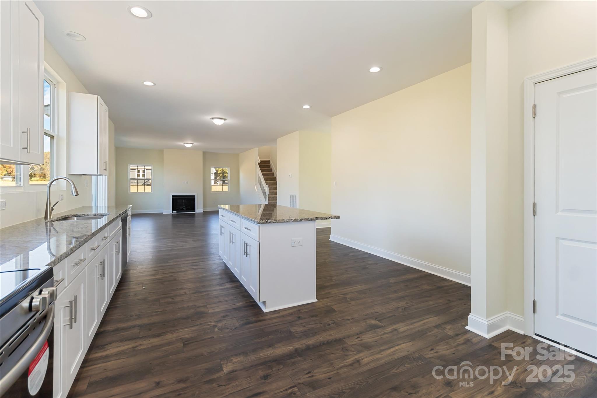 1012 Heath Helms Road Monroe, NC 28110 - Photo 19 of 48 a view of a kitchen with wooden floor and a sink