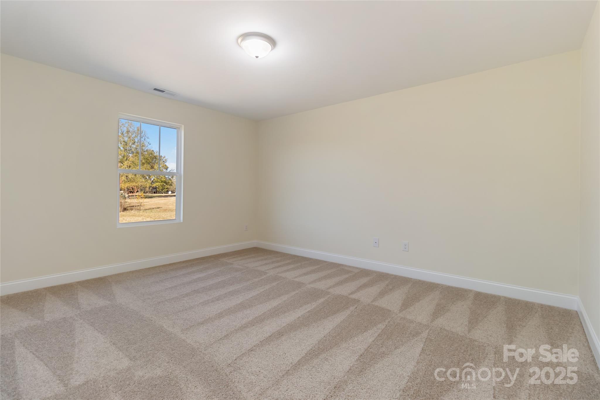 1012 Heath Helms Road Monroe, NC 28110 - Photo 21 of 48 an empty room with a window